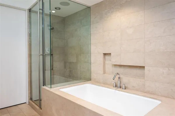 a bathroom with a sink and a shower