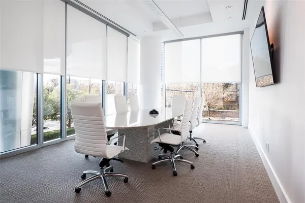 a living room with furniture a ceiling fan and a rug