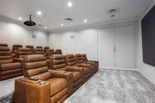 a living room with furniture and painting on the wall