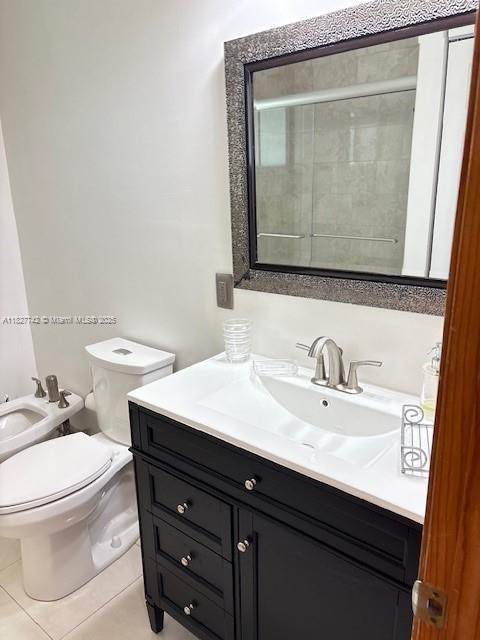 13736 Southwest 12th Street Miami, FL 33184 - Photo 11 of 14 a bathroom with a sink a toilet and mirror