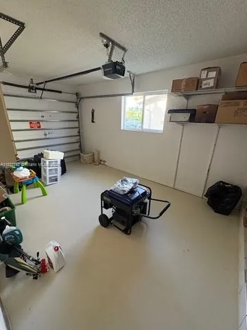 a bedroom with furniture and a chandelier