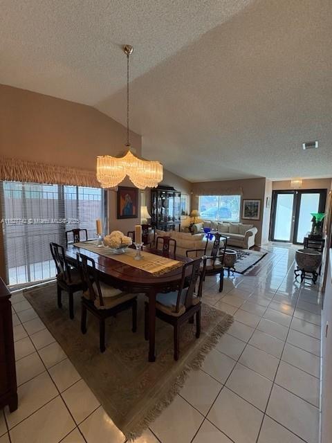 13736 Southwest 12th Street Miami, FL 33184 - Photo 3 of 14 a view of a dining room and livingroom with furniture wooden floor a rug a painting and a chandelier