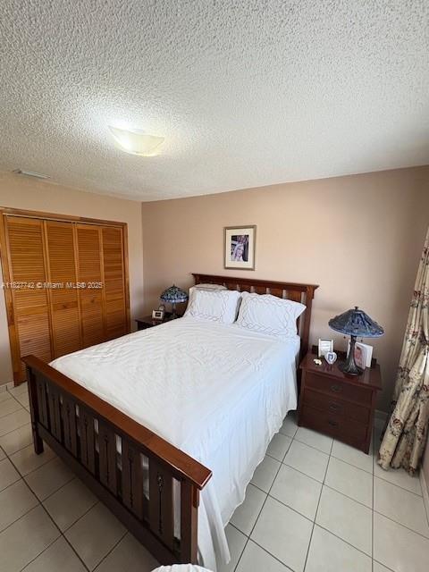 13736 Southwest 12th Street Miami, FL 33184 - Photo 8 of 14 a spacious bedroom with a bed and a dresser