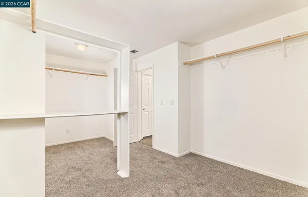 a balcony with wooden floor and fence