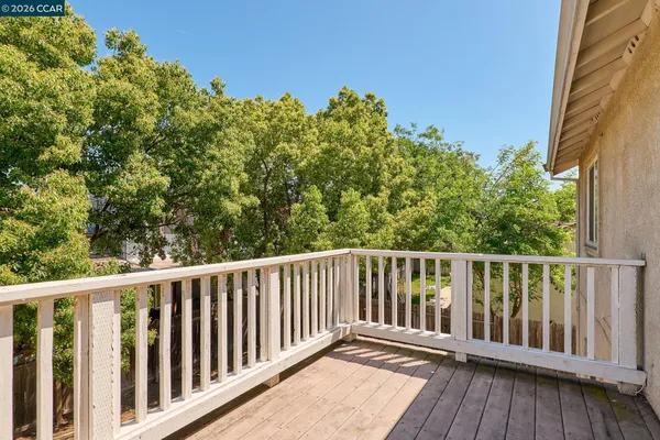 a view of a balcony with wooden floor