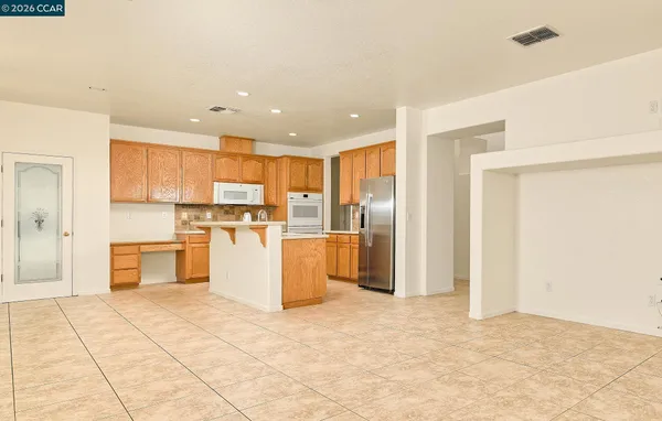 a view of a kitchen with a sink and kitchen counter space