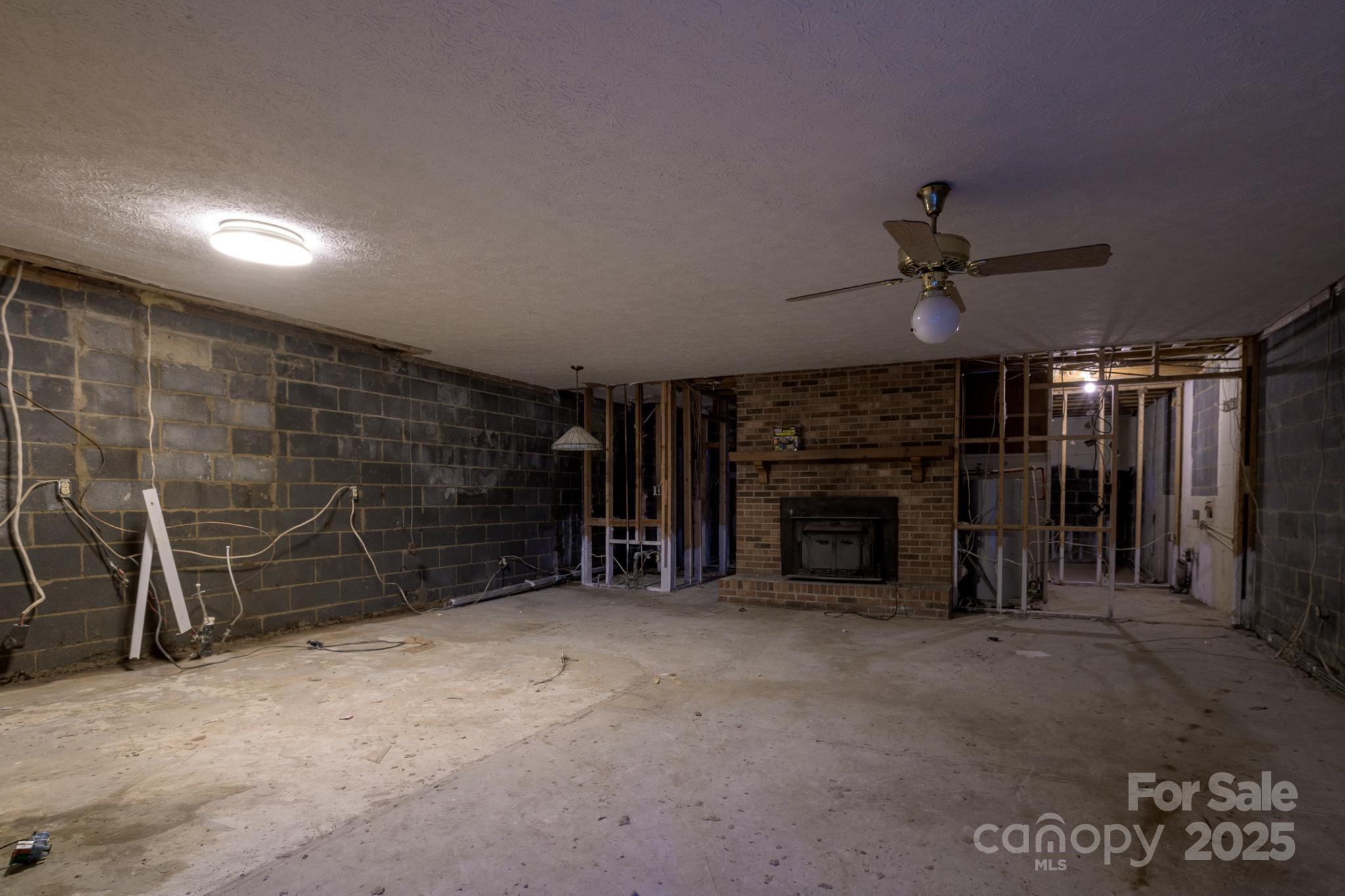 184 Buff Ridge Road Boone, NC 28607 - Photo 24 of 42 a view of a livingroom with a fireplace