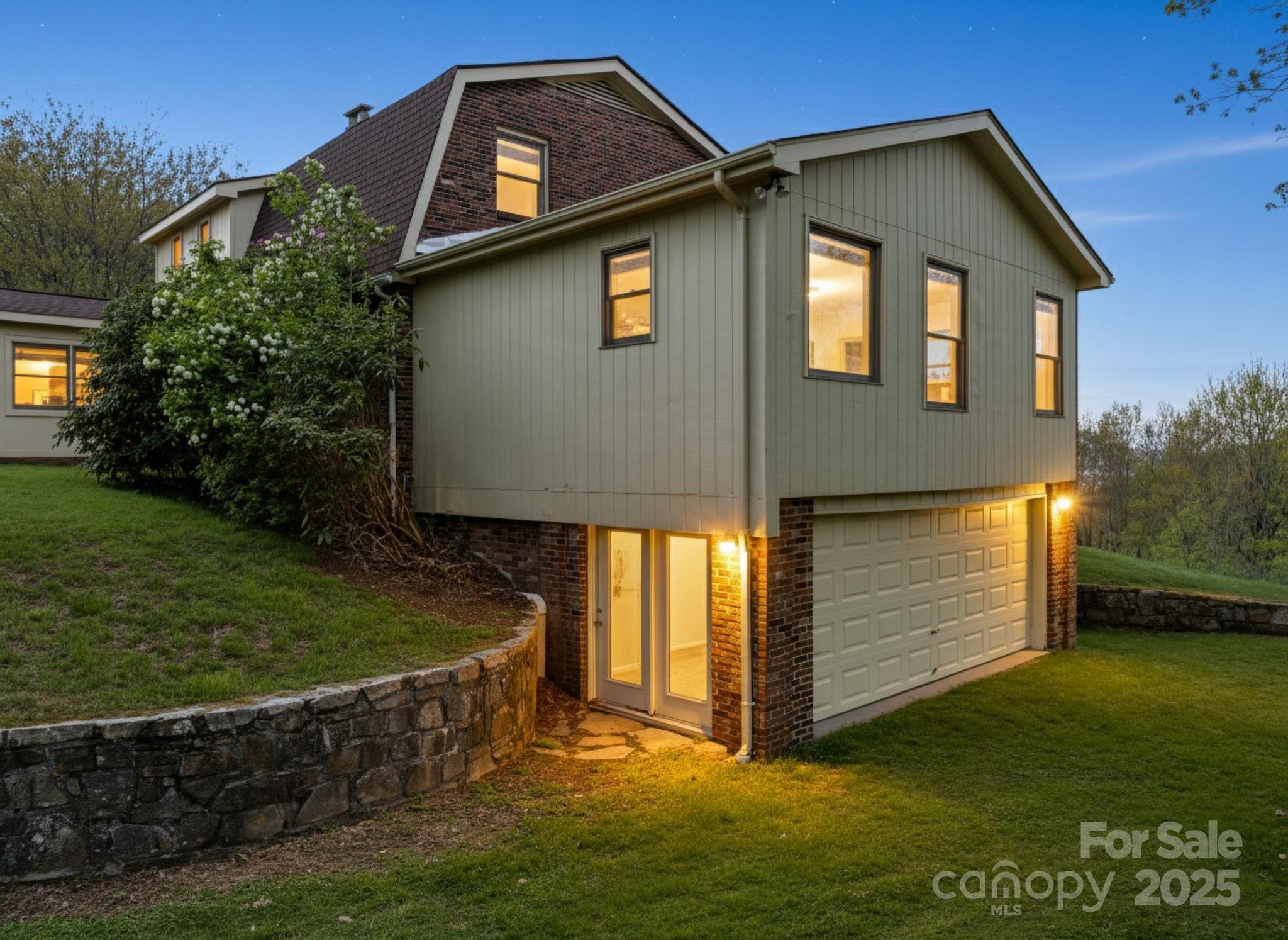 184 Buff Ridge Road Boone, NC 28607 - Photo 26 of 42 a front view of a house with garden