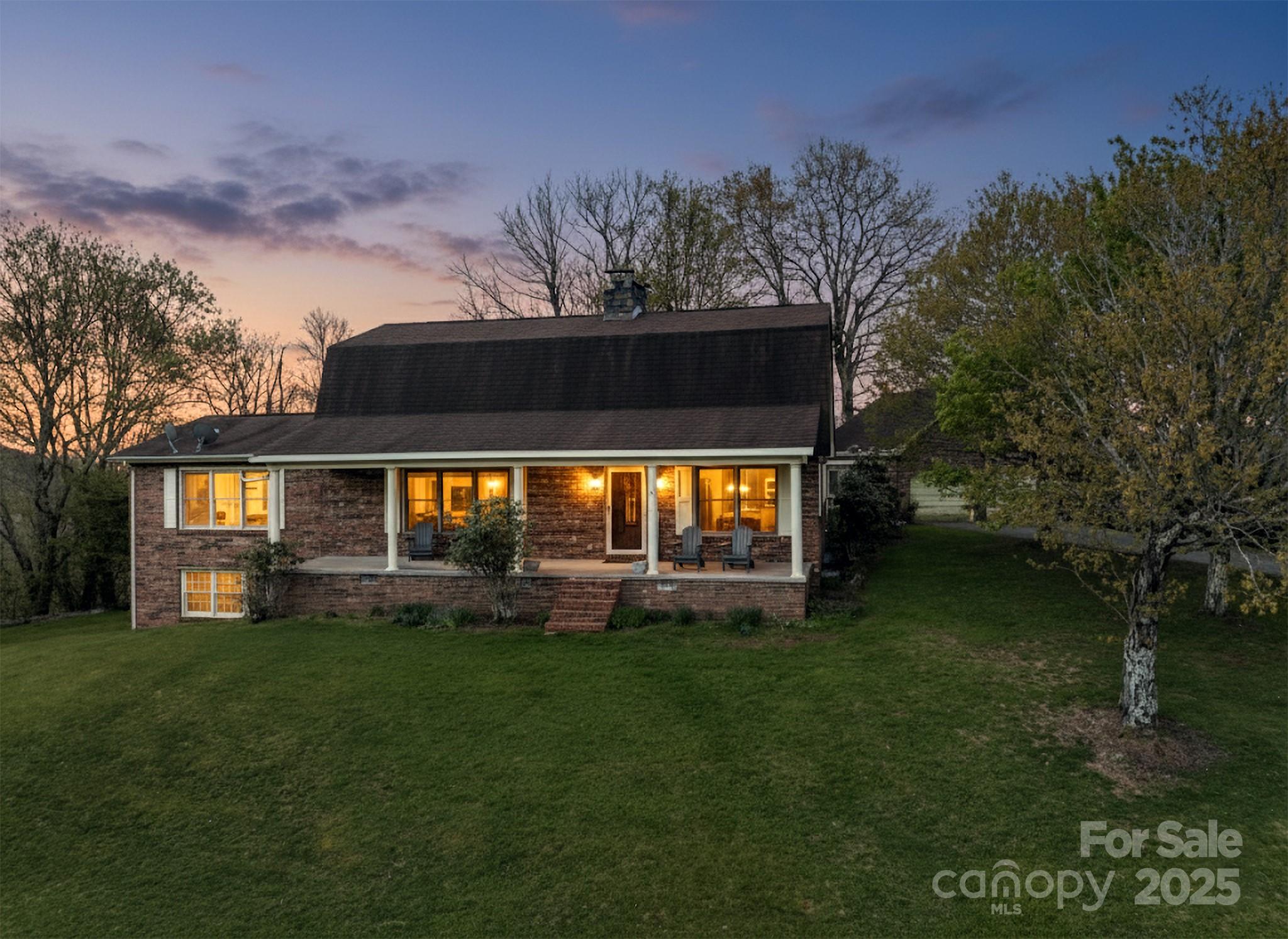184 Buff Ridge Road Boone, NC 28607 - Photo 29 of 42 a view of a house with a yard