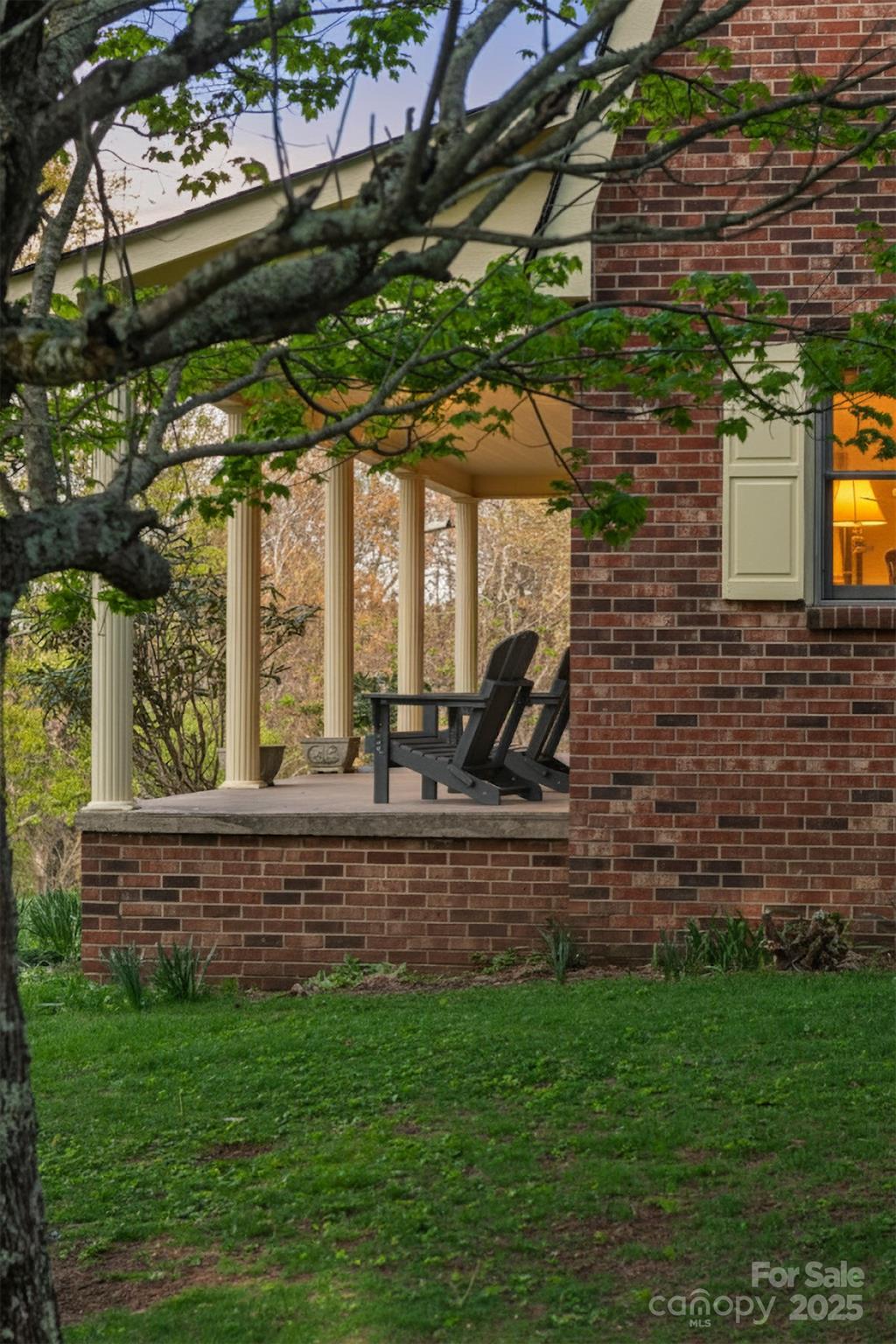 184 Buff Ridge Road Boone, NC 28607 - Photo 3 of 42 a view of a porch with a bench in front of house