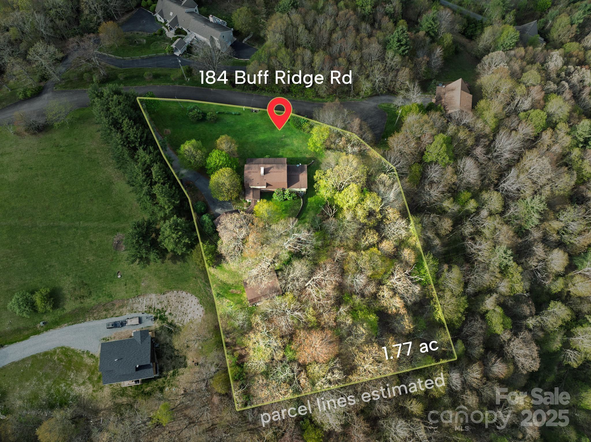 184 Buff Ridge Road Boone, NC 28607 - Photo 31 of 42 a sign that is sitting on a brick wall