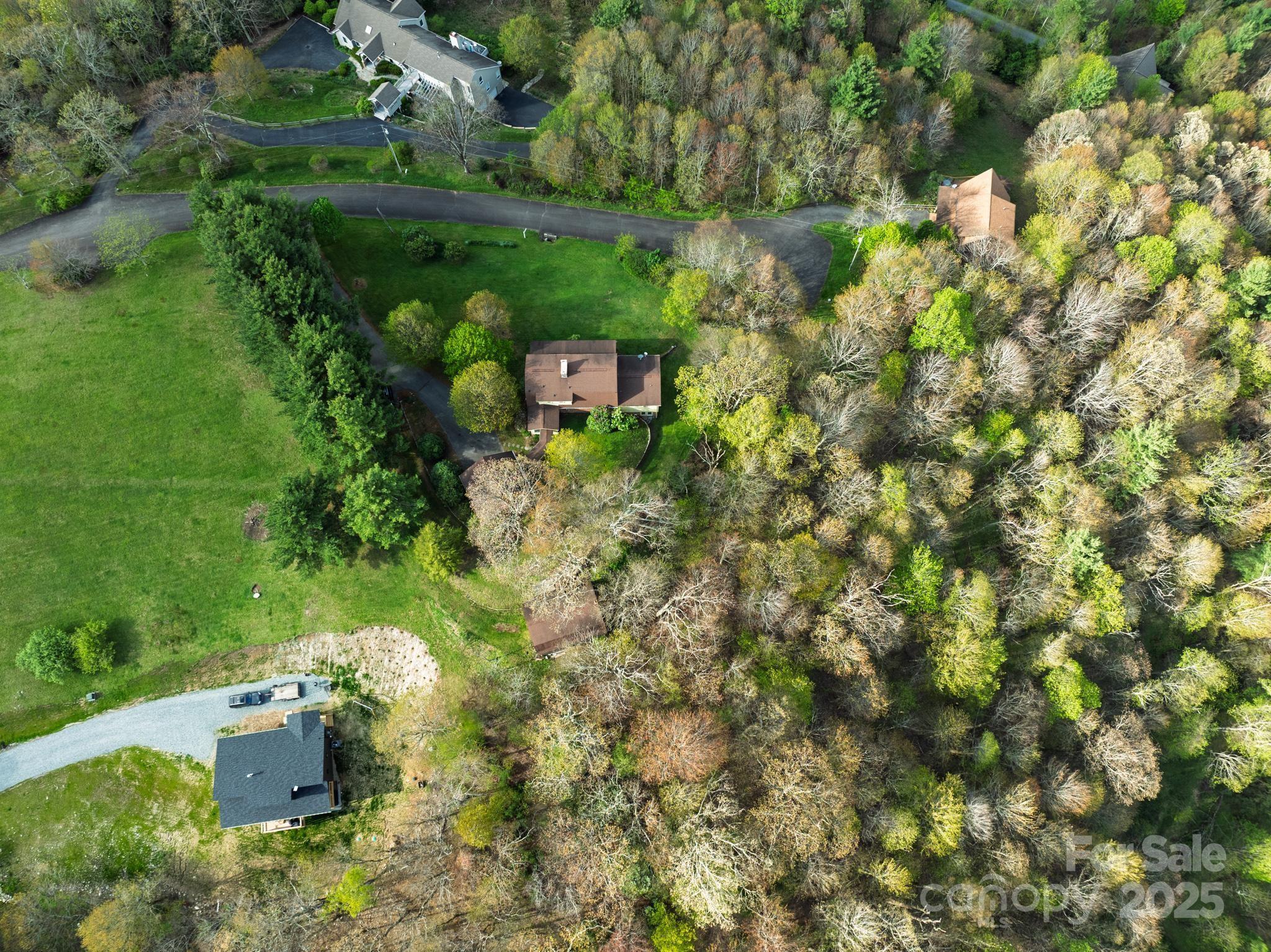 184 Buff Ridge Road Boone, NC 28607 - Photo 32 of 42 an aerial view of a house with a yard