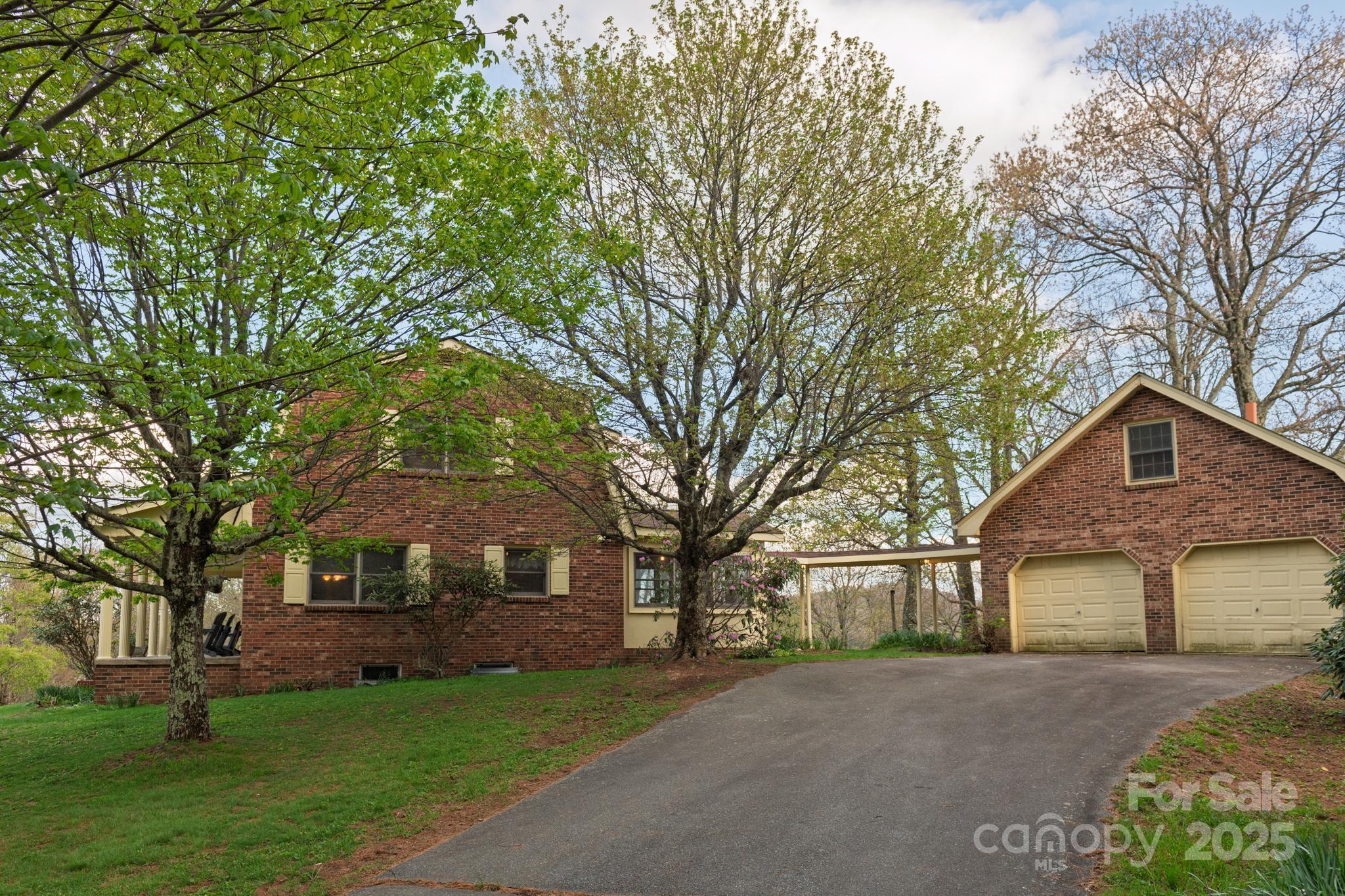 184 Buff Ridge Road Boone, NC 28607 - Photo 38 of 42 front view of a house with a yard