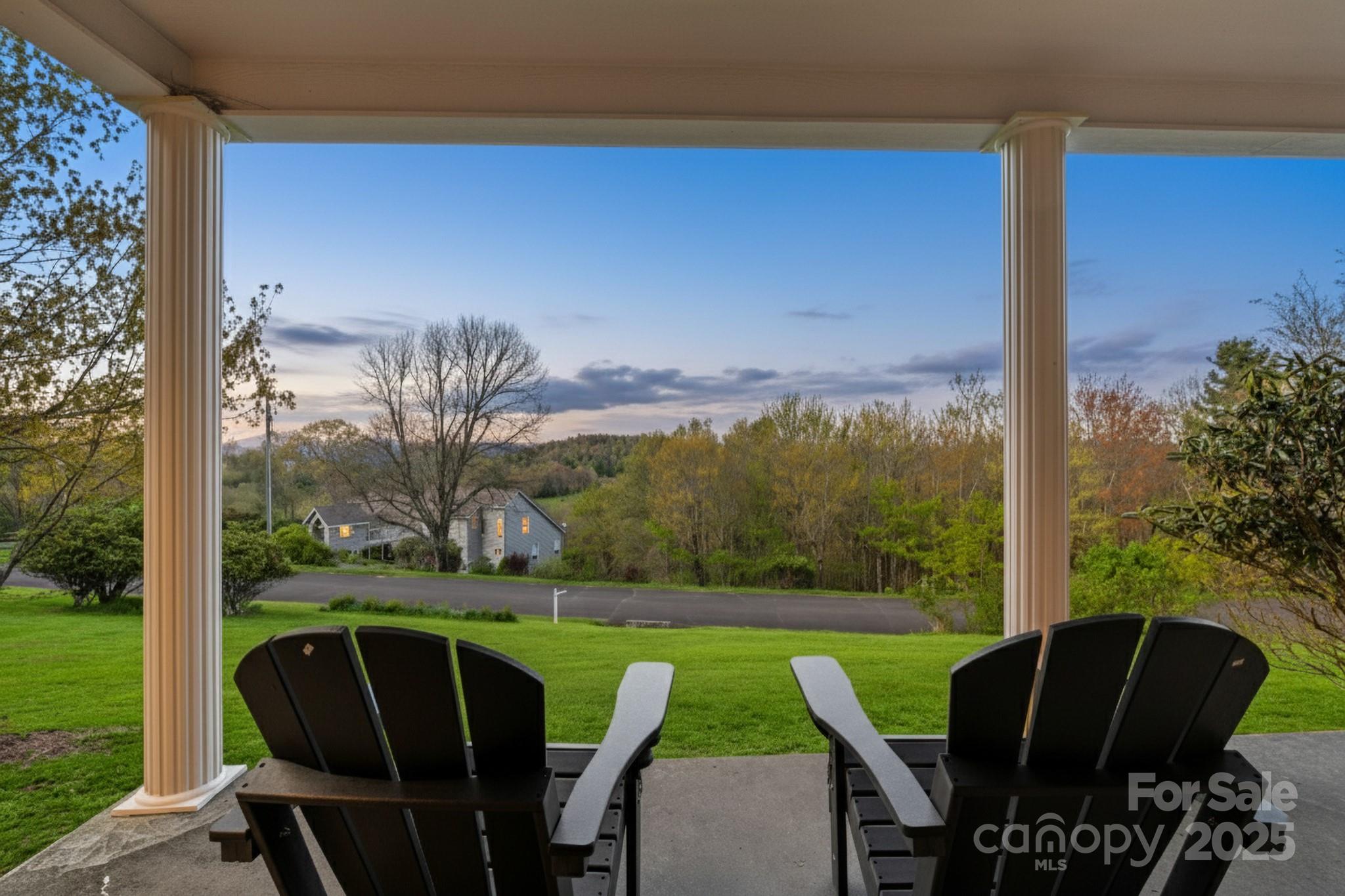 184 Buff Ridge Road Boone, NC 28607 - Photo 42 of 42 a view of a patio with chairs and a yard