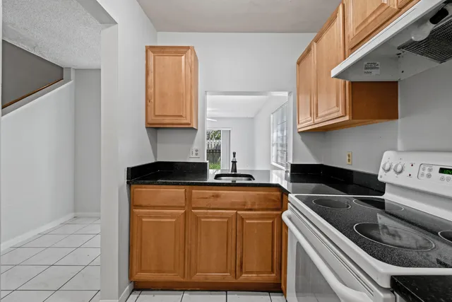 a kitchen with a stove and a microwave