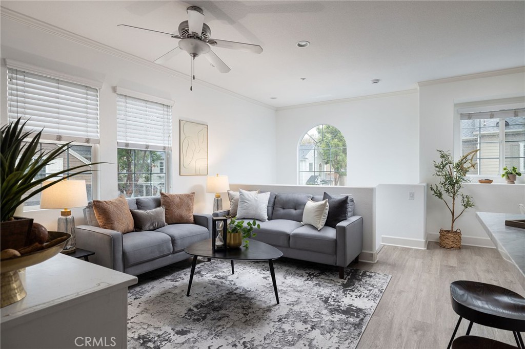 34 Bayley Street Ladera Ranch, CA 92694 - Photo 13 of 24 a living room with furniture ceiling fan and a window