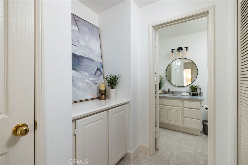 34 Bayley Street Ladera Ranch, CA 92694 - Photo 16 of 24 a bathroom with a sink and a mirror