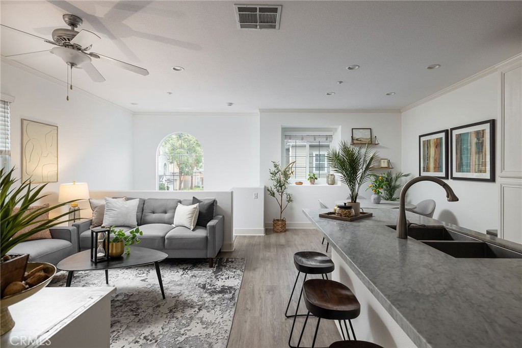 34 Bayley Street Ladera Ranch, CA 92694 - Photo 5 of 24 a living room with furniture potted plant and a window