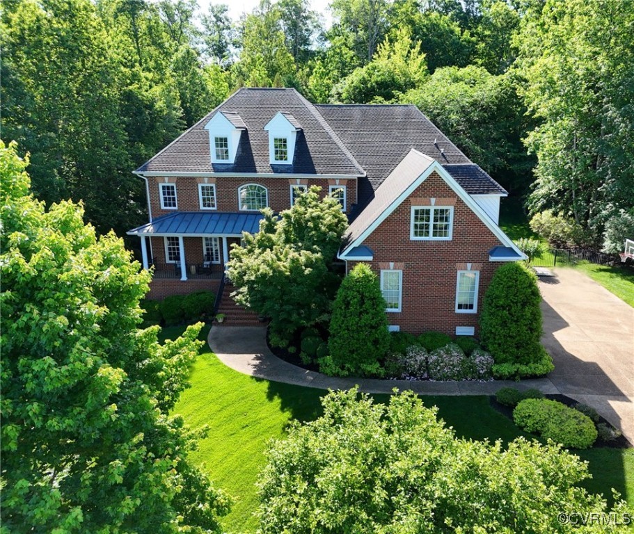 View of front of house with covered porch, stairwa