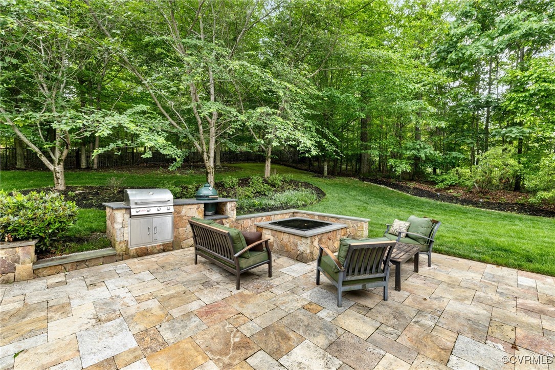 14149 Riverdowns S Drive Midlothian, VA 23113 - Photo 47 of 48 View of patio featuring a fire pit and area for gr