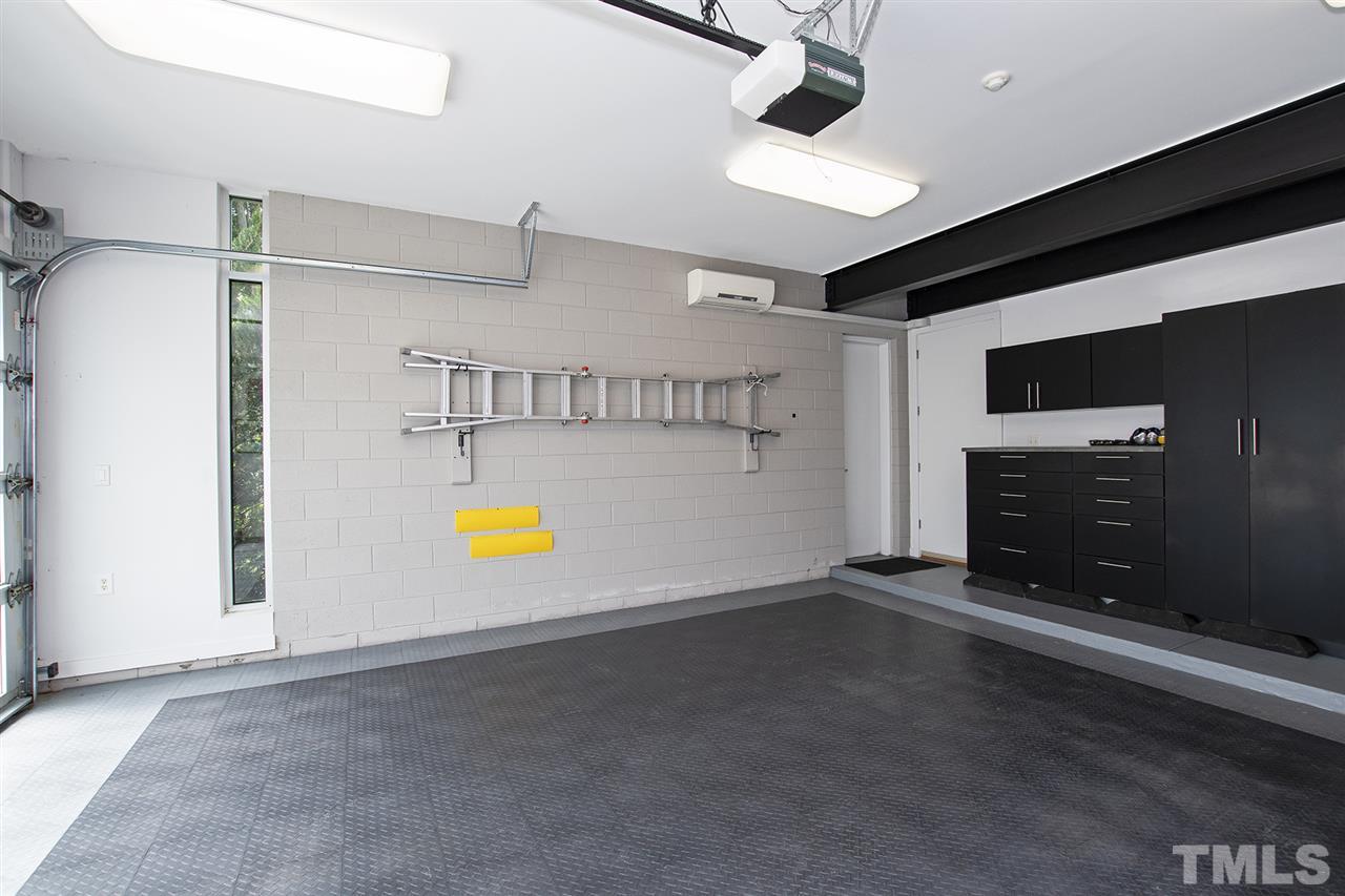1825 Stillwater Drive Raleigh, NC 27607 - Photo 21 of 22 an empty room with windows and fireplace