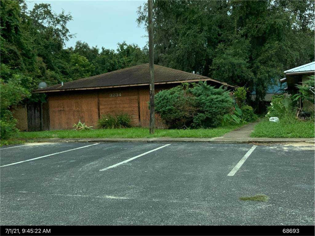 a backyard of a house with lots of green space