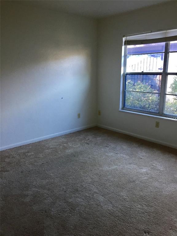 3234 Southwest 25th Drive Gainesville, FL 32608 - Photo 2 of 6 an empty room with a window