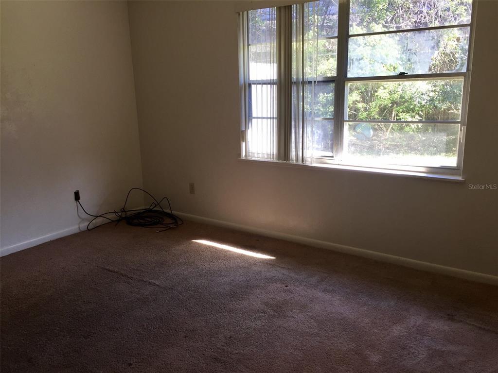 3234 Southwest 25th Drive Gainesville, FL 32608 - Photo 3 of 6 an empty room with a window