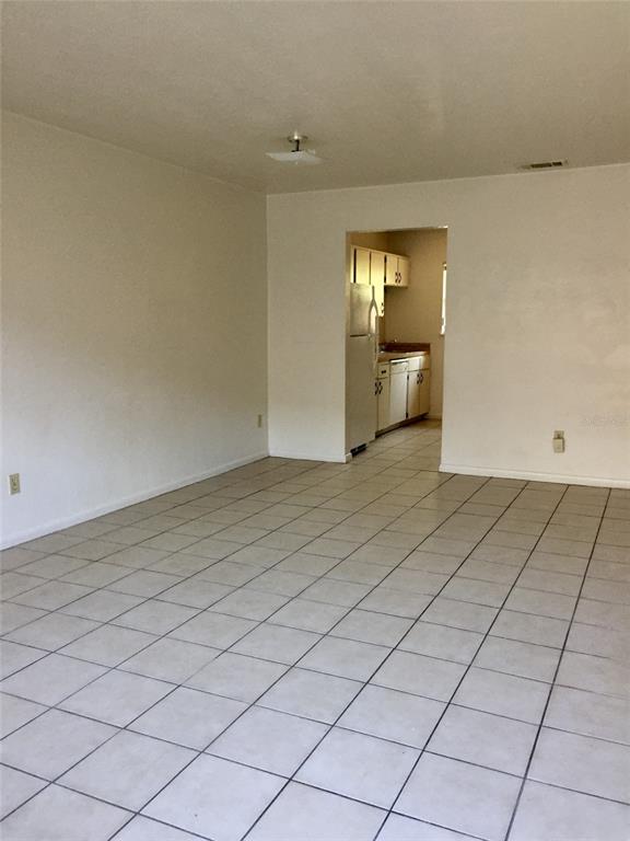 3234 Southwest 25th Drive Gainesville, FL 32608 - Photo 4 of 6 a view of an empty room and window
