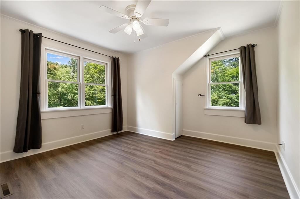 9550 Harding Road Pittsburgh, PA 15237 - Photo 32 of 44 a view of an empty room with wooden floor and a window