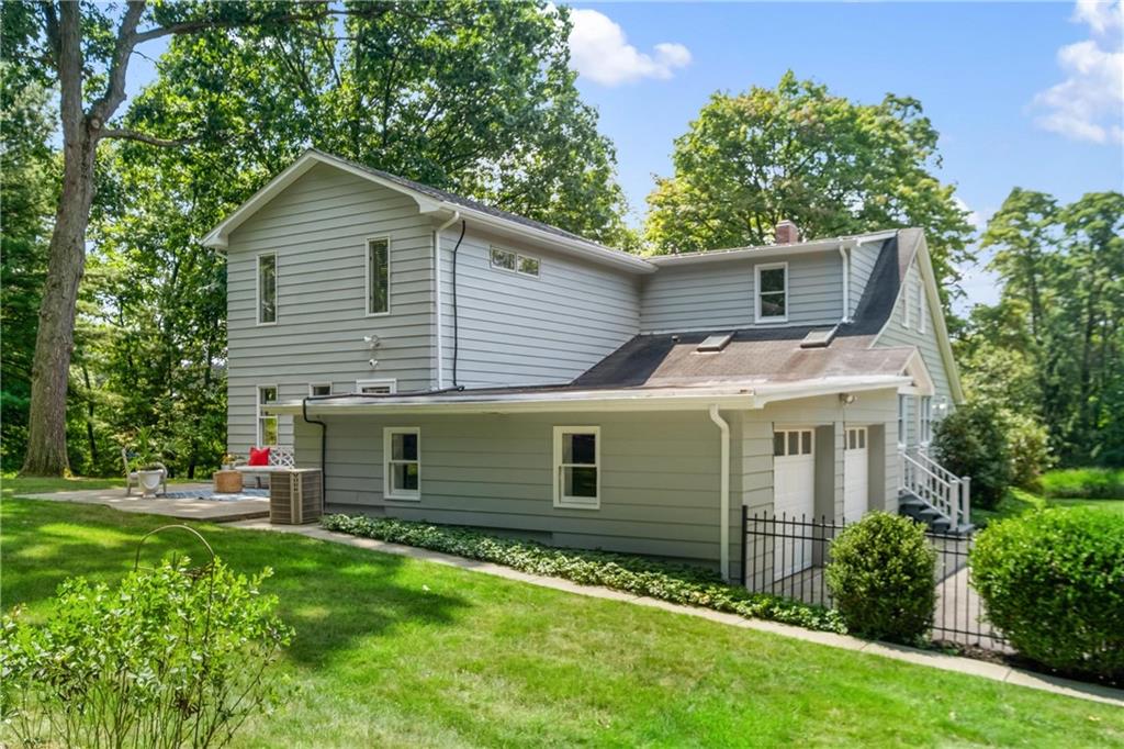 9550 Harding Road Pittsburgh, PA 15237 - Photo 40 of 44 a front view of a house with a garden