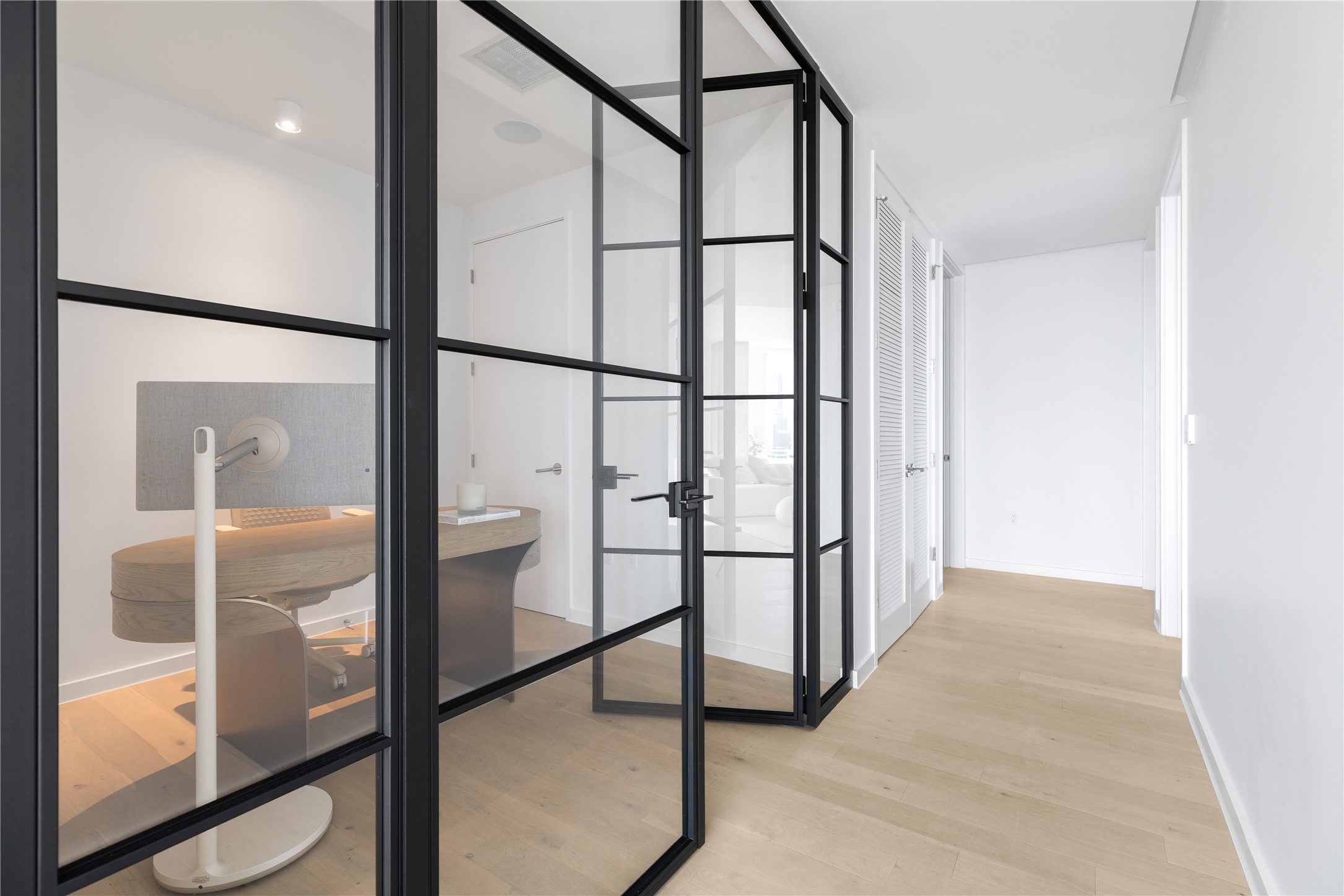 313 West 17th Street, Unit 2007 Austin, TX 78701 - Photo 15 of 38 Hallway featuring light wood-style floors and baseboards