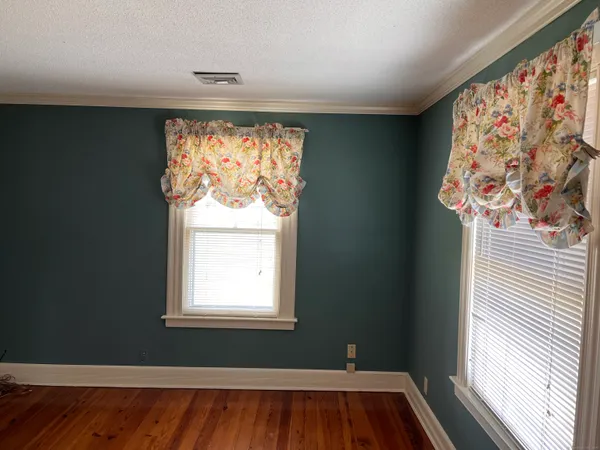 a view of front door with wooden floor