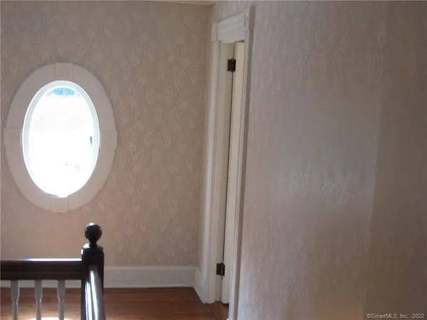 a view of a small space with wooden floor