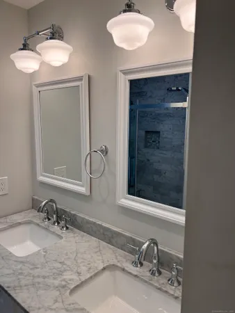 a view of a room with wooden floor and a sink