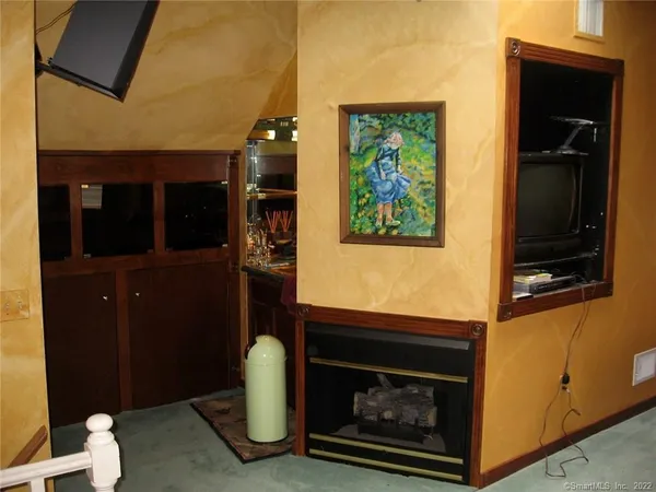 a view of backyard with plants and outdoor seating