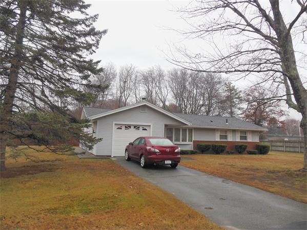 7 Dondi Road Beverly, MA 01915 - Photo 20 of 22 a car parked in front of a house