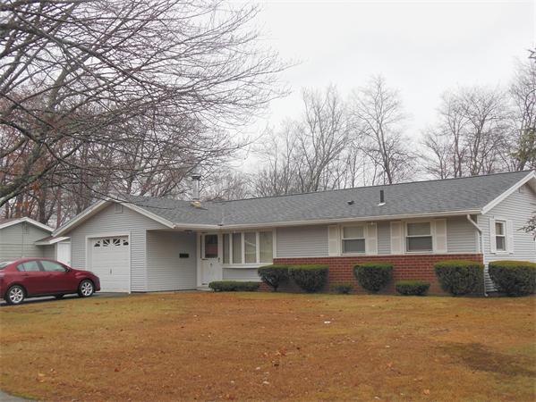 7 Dondi Road Beverly, MA 01915 - Photo 21 of 22 a front view of a house with a yard and garage