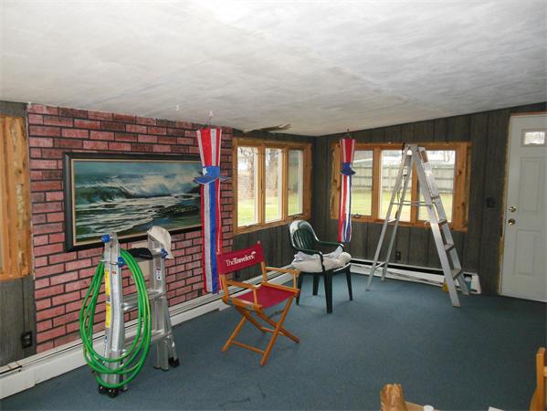 7 Dondi Road Beverly, MA 01915 - Photo 7 of 22 a living room with furniture a flat screen tv and a window