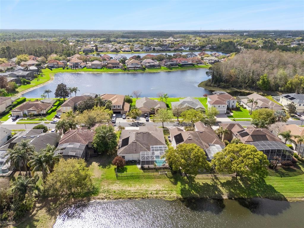 2541 Teton Stone Run Orlando, FL 32828 - Photo 15 of 82 an aerial view of a houses with a lake view