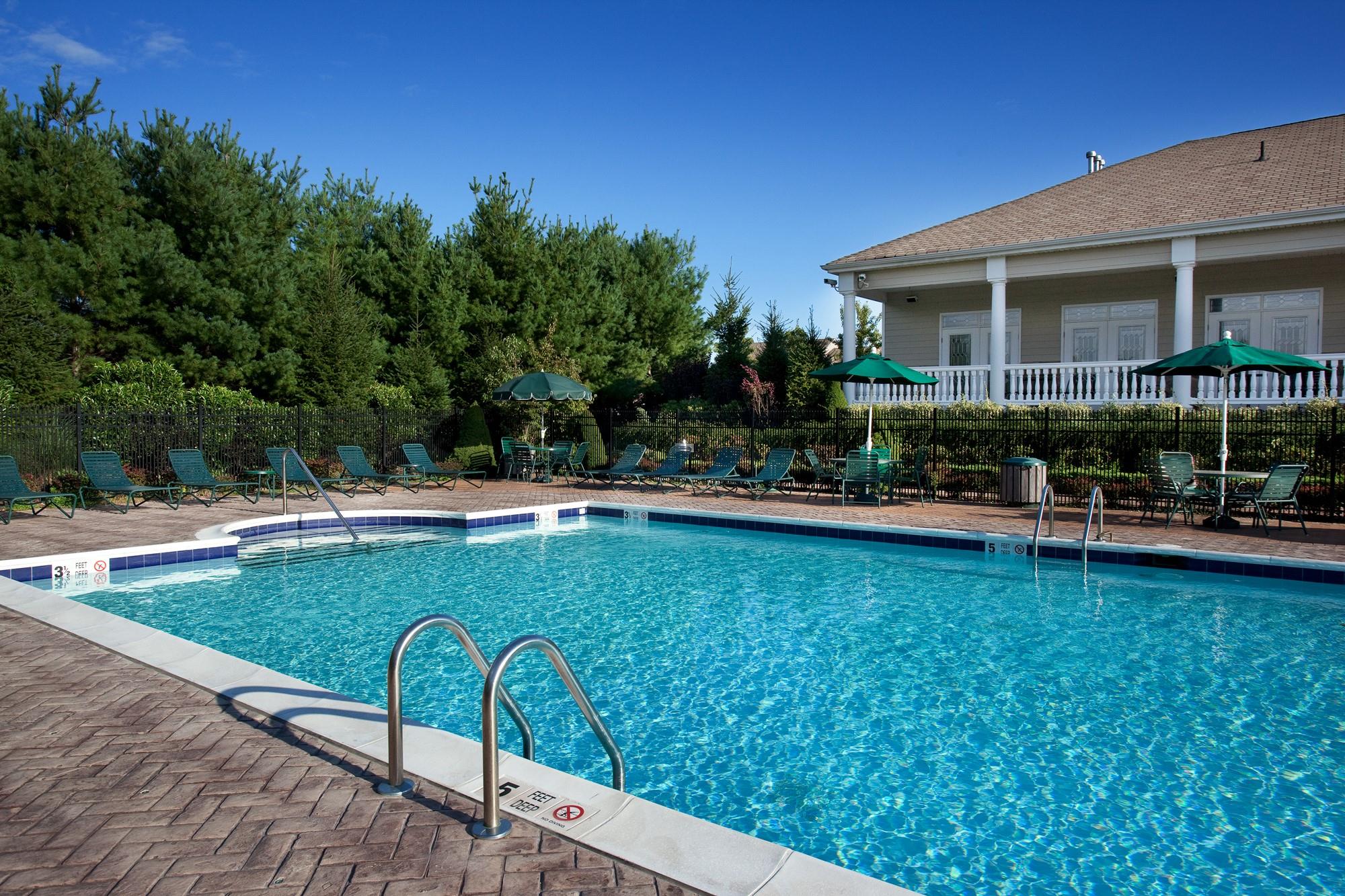 a view of a swimming pool with a patio