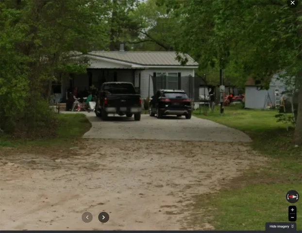 a aerial view of a house with a yard