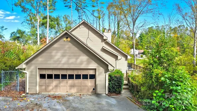 a view of a house with a tree