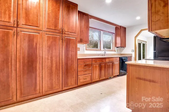 a view of a kitchen with furniture and window