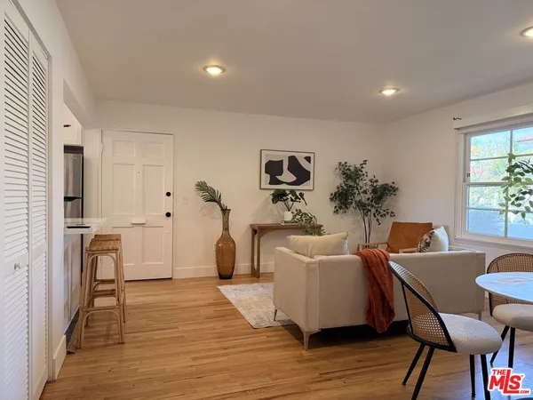a living room with furniture and a table