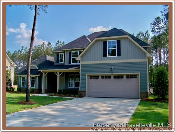 125 Timberhurst Court Carthage, NC 28326 - Photo 1 of 2 a front view of a house with a garden and yard