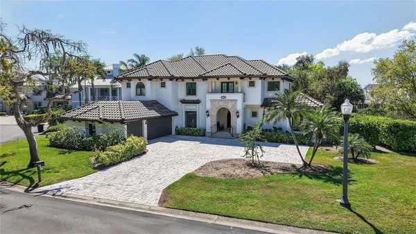 a view of a house with garden and trees
