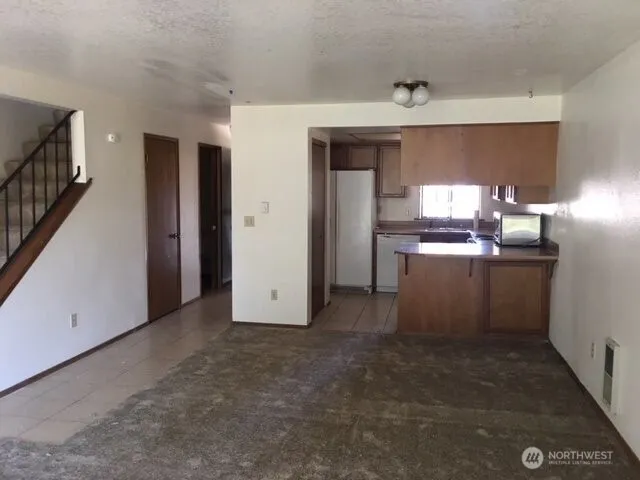 a view of a kitchen with a sink