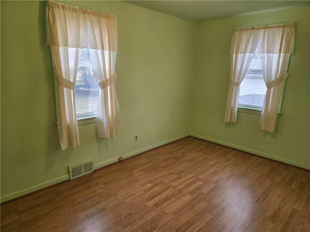 206 Haddon Road Greece, NY 14626 - Photo 11 of 18 Bedroom 2 with laminate floors