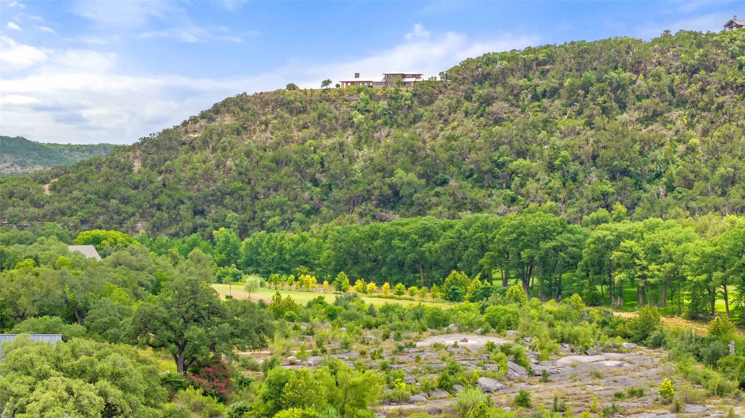 200 Rim Road Wimberley, TX 78676 - Photo 6 of 25 This lot is private and amazing hill views and trees along with ultimate waterfrontage.